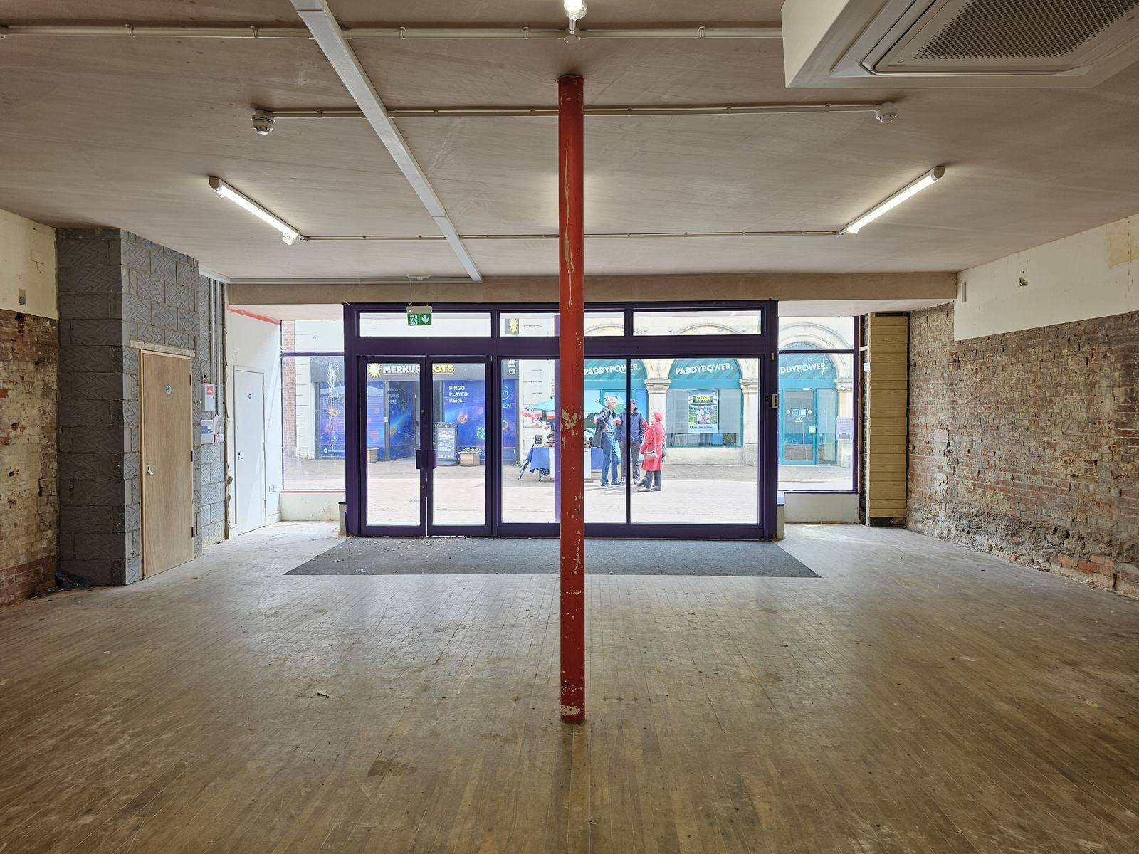 Interior view to the street through full-width glazing